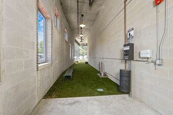 a hallway with a green carpet in the middle at Inspire West Town, CHICAGO, Illinois